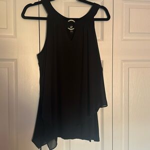 Black sleeveless blouse with gold metal detail.
